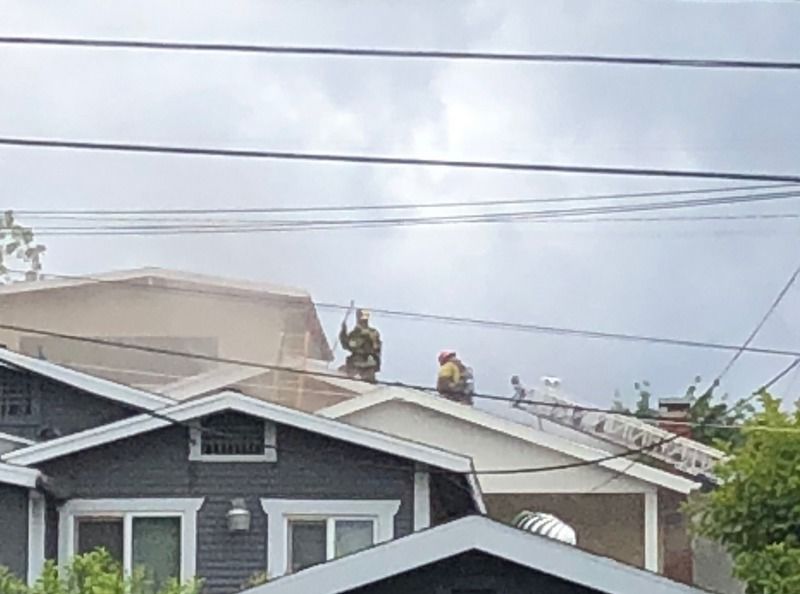 Firefighters on rooftop 1400 block of N. Mt. Pleasant Avenue
